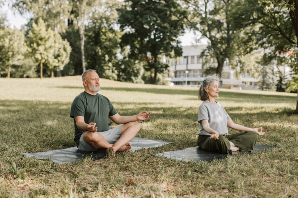 A man and a women practicing meditation